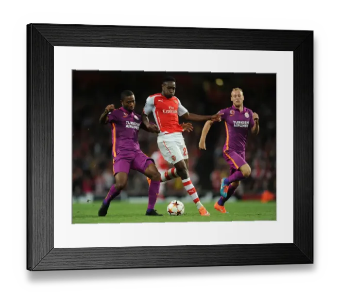 Framed Print : Danny Welbeck Stands Firm Against Galatasaray's Aurelien Chedjou and Semih Kaya in Intense Arsenal-Galatasaray Champions League Showdown Framed Print : Danny Welbeck Stands Firm Against Galatasaray's Aurelien Chedjou and Semih Kaya in Intense Arsenal-Galatasaray Champions League Showdown
