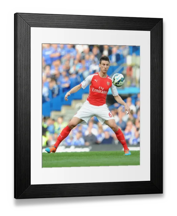 Framed Print : Laurent Koscielny Faces Off Against Chelsea in the 2014-15 Premier League Clash
