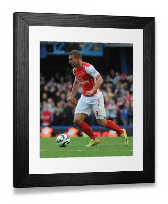 Framed Print : Arsenal's Lukas Podolski Faces Off Against Chelsea at Stamford Bridge (2014-15 Premier League) Framed Print : Arsenal's Lukas Podolski Faces Off Against Chelsea at Stamford Bridge (2014-15 Premier League)