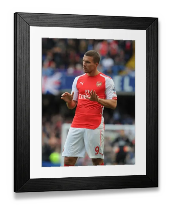 Framed Print : Arsenal's Podolski Clashes with Chelsea at Stamford Bridge (2014-15 Premier League) Framed Print : Arsenal's Podolski Clashes with Chelsea at Stamford Bridge (2014-15 Premier League)