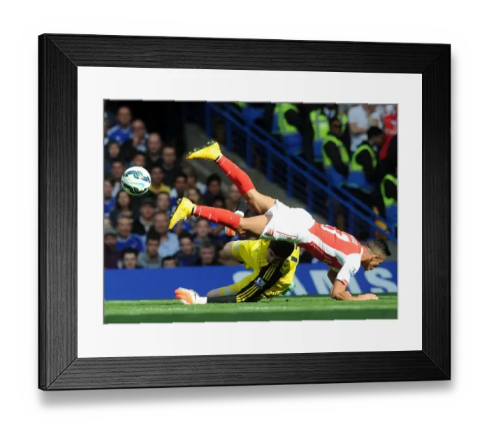 Framed Print : Arsenal's Alexis Sanchez Stumbles Against Chelsea's Thibaut Courtois - Premier League 2014-15