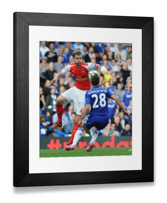 Framed Print : Mertesacker vs Azpilicueta: Intense Battle at Stamford Bridge - Chelsea vs Arsenal, Premier League 2014-15