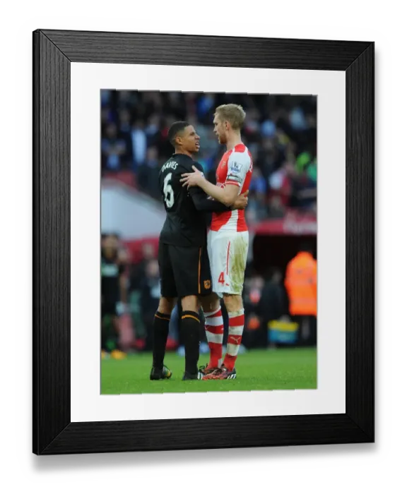 Framed Print : Per Mertesacker (Arsenal) Curtis Davies (Hull). Arsenal 2: 2 Hull City. Barclays Premier League Framed Print : Per Mertesacker (Arsenal) Curtis Davies (Hull). Arsenal 2: 2 Hull City. Barclays Premier League