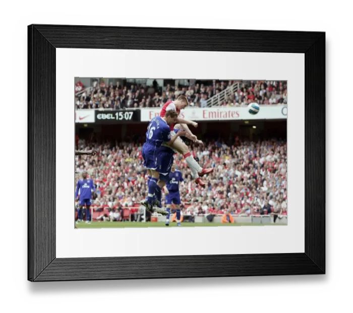 Framed Print : Nicklas Bendtner scores Arsenals goal under pressure from Phil Jagielka (Everton)