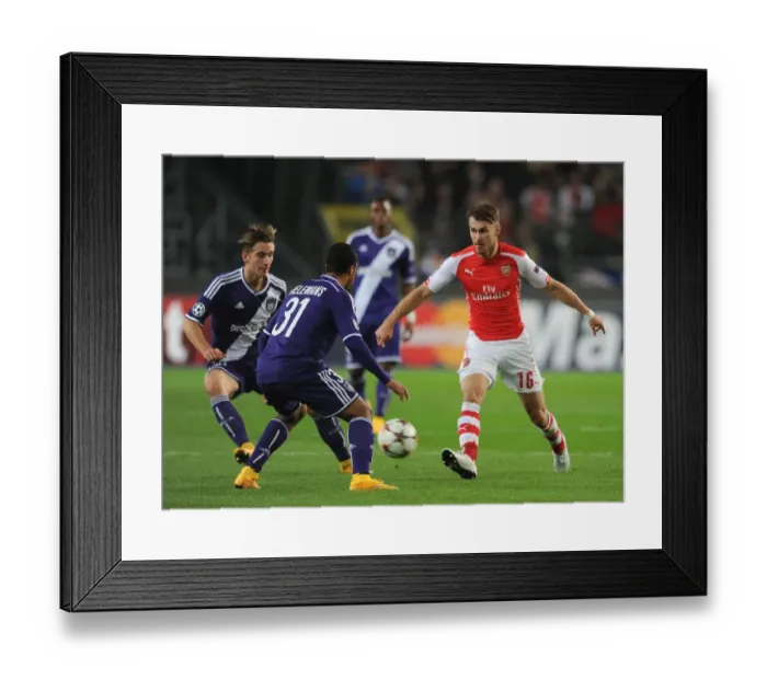 Framed Print : Arsenal's Aaron Ramsey Faces Off Against Anderlecht Duo Youri Tielemans and Dennis Praet in UEFA Champions League Clash