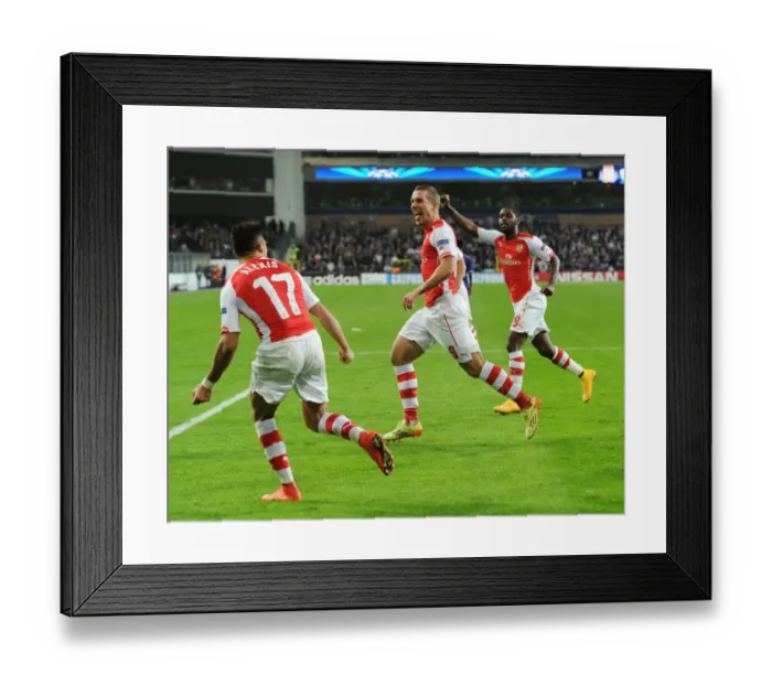 Framed Print : Podolski Scores Arsenal's Second Goal in Champions League Clash against RSC Anderlecht