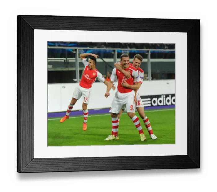 Framed Print : Anderlecht vs Arsenal: Lukas Podolski Scores Brace, Alexis Sanchez and Aaron Ramsey Celebrate
