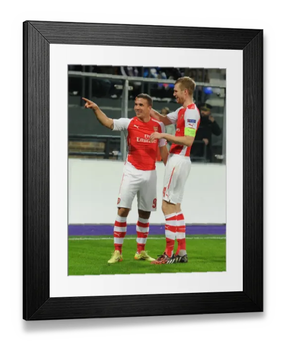 Framed Print : Podolski and Mertesacker Celebrate Arsenal's Second Goal Against Anderlecht in 2014-15 Champions League Framed Print : Podolski and Mertesacker Celebrate Arsenal's Second Goal Against Anderlecht in 2014-15 Champions League