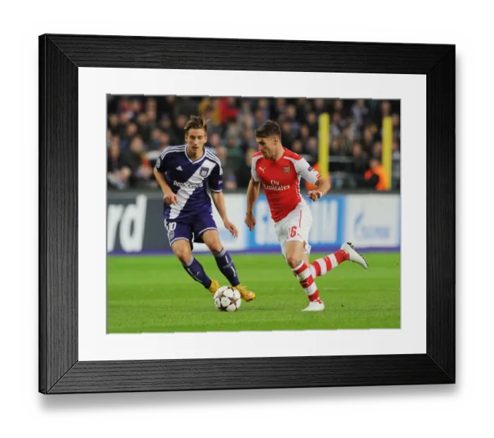Framed Print : Arsenal's Aaron Ramsey Scores Past Anderlecht's Dennis Praet in 2014-15 Champions League Clash
