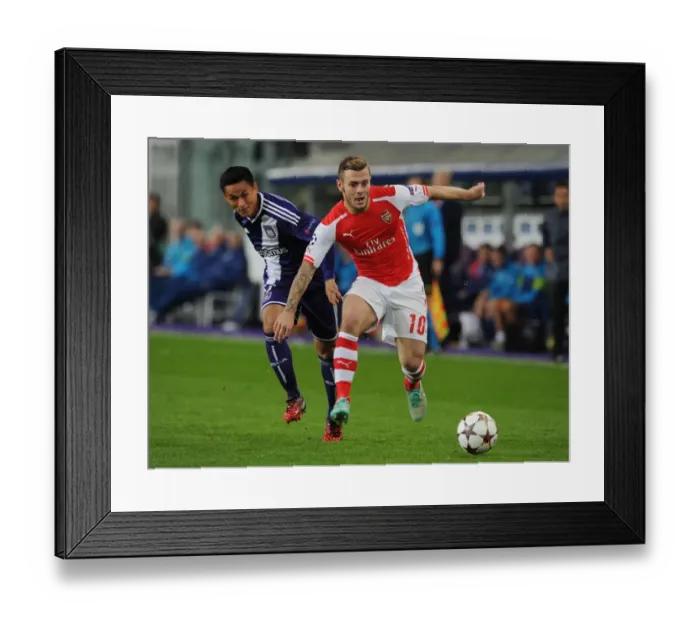 Framed Print : Jack Wilshere vs. Andy Najar: Clash in the UEFA Champions League