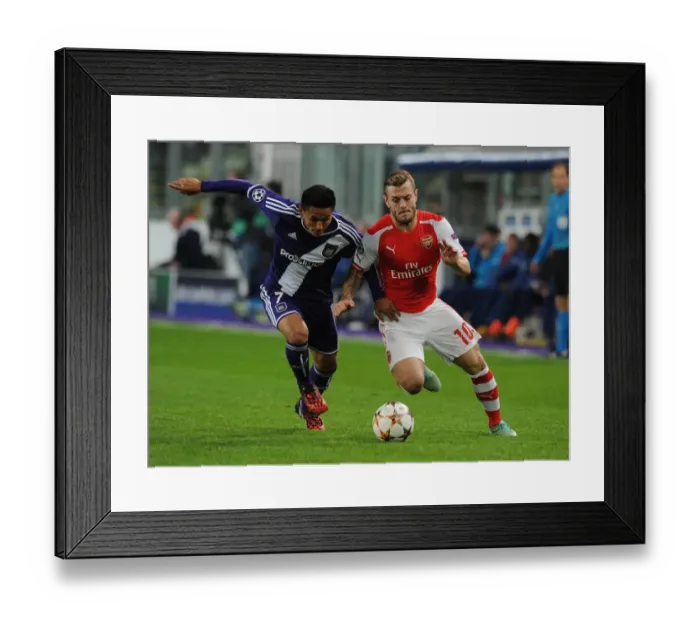 Framed Print : Jack Wilshere vs. Andy Najar: Midfield Battle in Arsenal's UEFA Champions League Clash with RSC Anderlecht (2014)