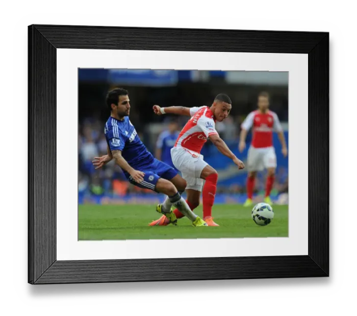 Framed Print : Clash of Titans: Oxlade-Chamberlain vs. Fabregas - Chelsea vs. Arsenal, Premier League 2014-15 Framed Print : Clash of Titans: Oxlade-Chamberlain vs. Fabregas - Chelsea vs. Arsenal, Premier League 2014-15