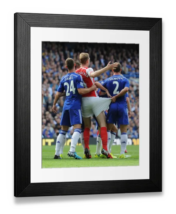 Framed Print : Clash of Titans: Mertesacker vs. Cahill & Ivanovic - Chelsea vs. Arsenal, Premier League 2014-15 Framed Print : Clash of Titans: Mertesacker vs. Cahill & Ivanovic - Chelsea vs. Arsenal, Premier League 2014-15