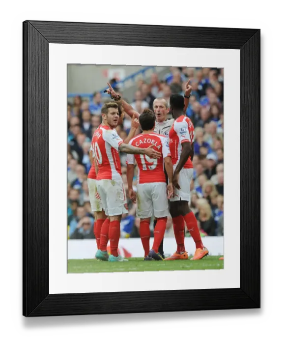 Framed Print : Arsenal's Dispute with Referee: Wilshere, Cazorla, and Welbeck at Chelsea's Stamford Bridge (2014-15) Framed Print : Arsenal's Dispute with Referee: Wilshere, Cazorla, and Welbeck at Chelsea's Stamford Bridge (2014-15)