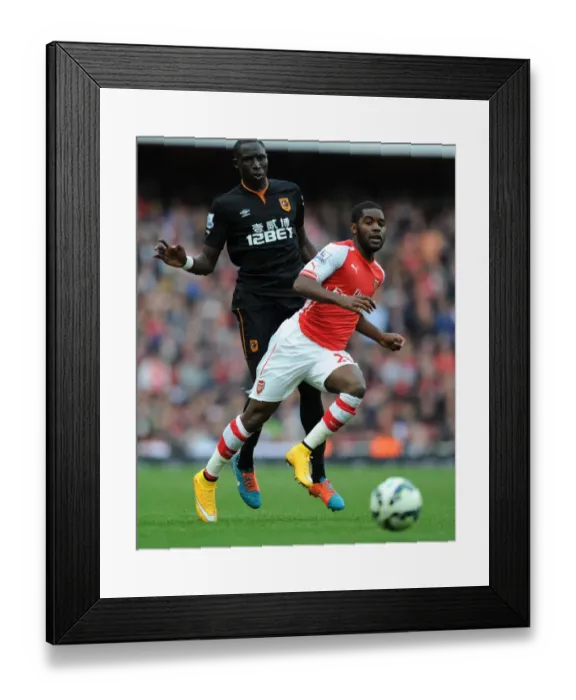 Framed Print : Arsenal's Joel Campbell Outmaneuvers Hull's Mohamed Diame Framed Print : Arsenal's Joel Campbell Outmaneuvers Hull's Mohamed Diame