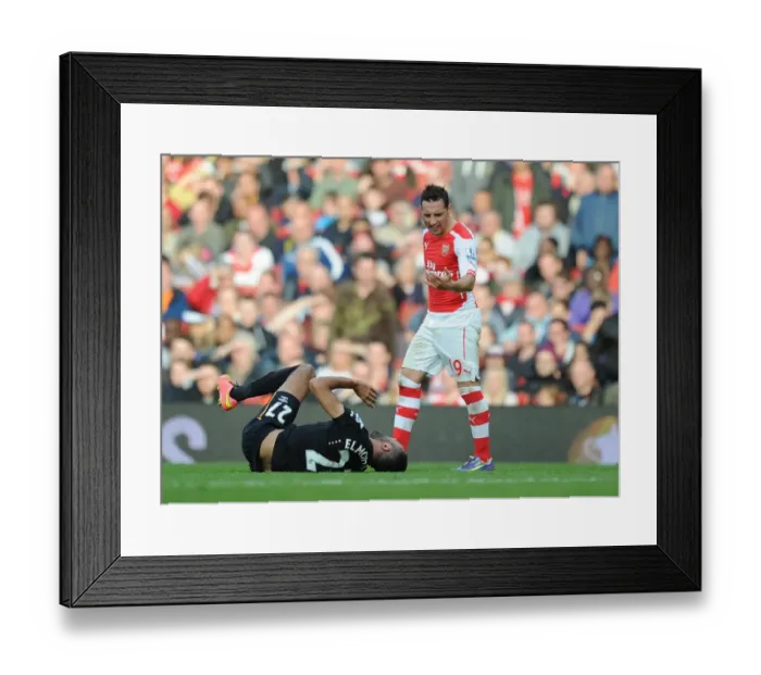Framed Print : Arsenal's Santi Cazorla Faces Off Against Hull's Ahmed Elmohamady during the 2014-15 Premier League Match Framed Print : Arsenal's Santi Cazorla Faces Off Against Hull's Ahmed Elmohamady during the 2014-15 Premier League Match