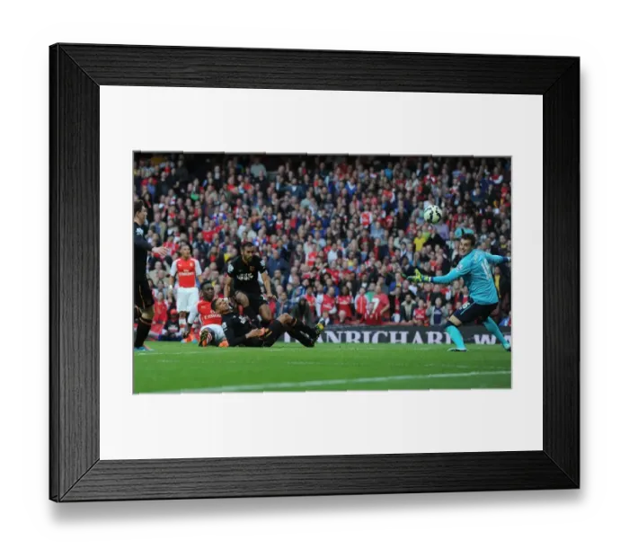 Framed Print : Danny Welbeck Scores Stunning Chip Over Eldin Jakupovic in Arsenal's Victory Against Hull City Framed Print : Danny Welbeck Scores Stunning Chip Over Eldin Jakupovic in Arsenal's Victory Against Hull City