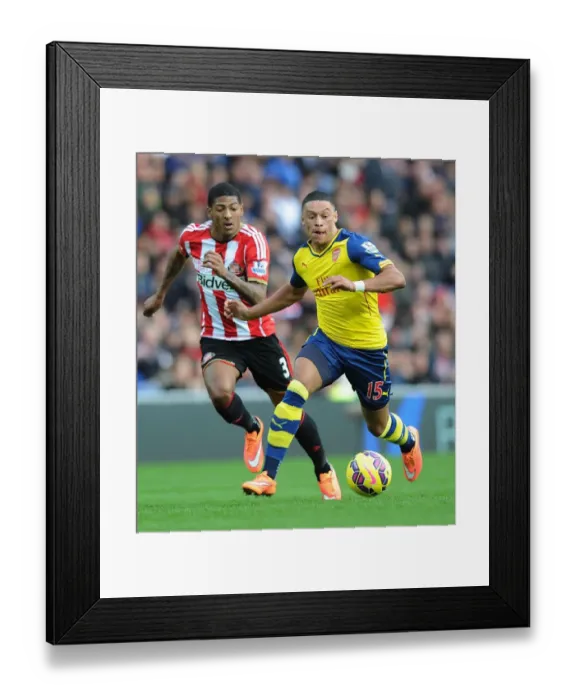 Framed Print : Arsenal's Alex Oxlade-Chamberlain Outmaneuvers Sunderland's Patrick van Aanholt Framed Print : Arsenal's Alex Oxlade-Chamberlain Outmaneuvers Sunderland's Patrick van Aanholt