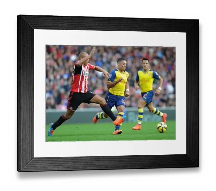 Framed Print : Alex Oxlade-Chamberlain Surges Past Wes Brown in Sunderland vs. Arsenal Premier League Clash