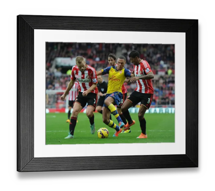 Framed Print : Arsenal's Kieran Gibbs Outmaneuvers Larsson and van Aanholt during Sunderland Clash