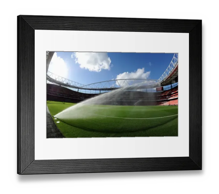 Framed Print : The pitch is watered before the match. Arsenal 3: 0 Burnley. Barclays Premier League Framed Print : The pitch is watered before the match. Arsenal 3: 0 Burnley. Barclays Premier League