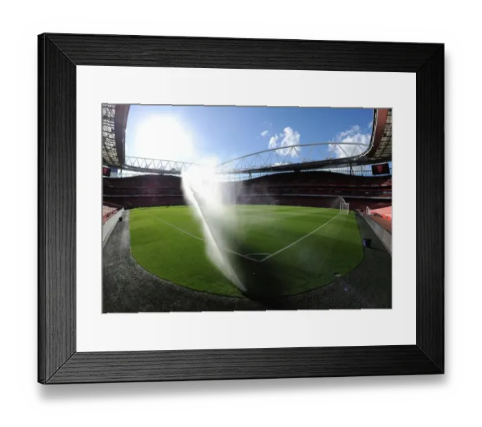 Framed Print : Arsenal's Wet Victory: 3-0 Over Burnley in the Premier League