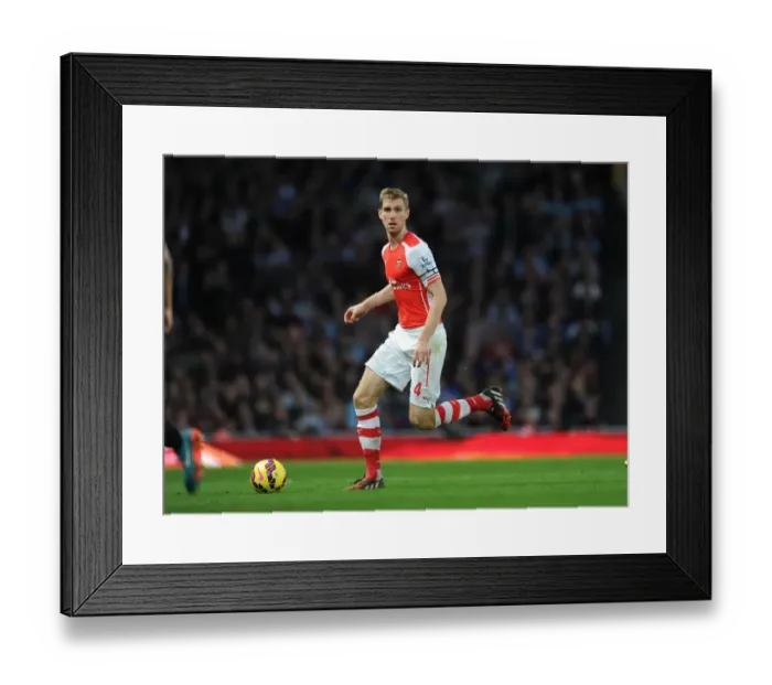 Framed Print : Per Mertesacker's Unwavering Focus: Arsenal's Triumph Over Burnley (2014 / 15)