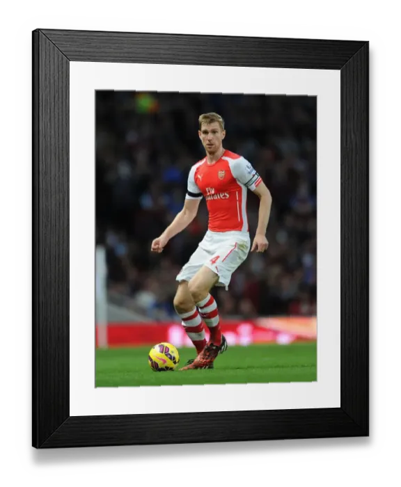 Framed Print : Per Mertesacker's Unwavering Concentration: Arsenal's Victory Against Burnley (2014 / 15)