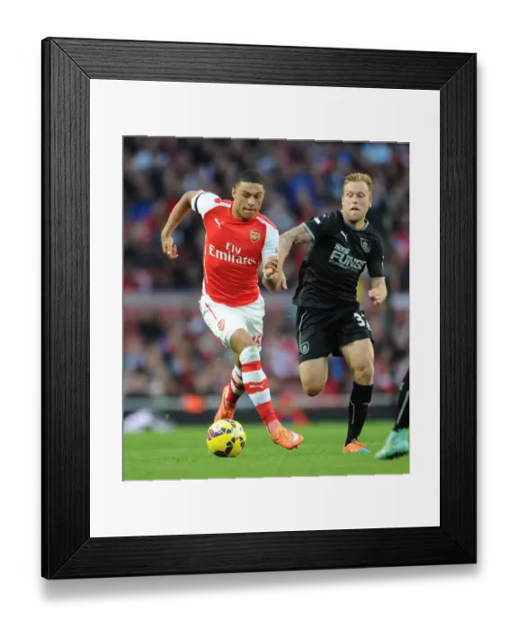 Framed Print : Arsenal's Alex Oxlade-Chamberlain Faces Off Against Burnley's Scott Arfield Framed Print : Arsenal's Alex Oxlade-Chamberlain Faces Off Against Burnley's Scott Arfield