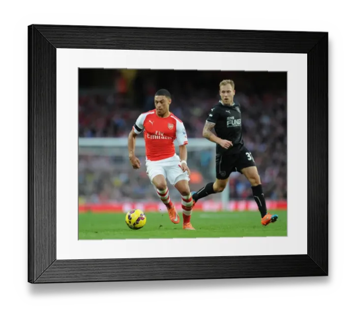 Framed Print : Arsenal's Oxlade-Chamberlain vs Burnley's Arfield: A Football Showdown