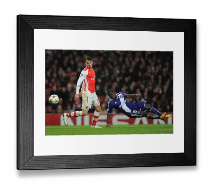 Framed Print : Clash of Stars: Ramsey vs. Acheampong in Arsenal's UEFA Champions League Battle Framed Print : Clash of Stars: Ramsey vs. Acheampong in Arsenal's UEFA Champions League Battle