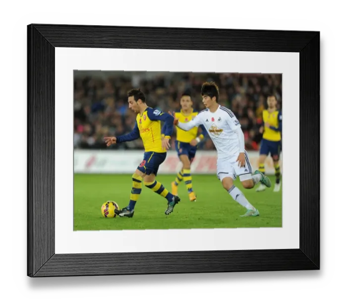 Framed Print : Clash of Midfield Maestros: Santi Cazorla vs. Ki Sung-Yueng (Swansea v Arsenal, 2014-15) Framed Print : Clash of Midfield Maestros: Santi Cazorla vs. Ki Sung-Yueng (Swansea v Arsenal, 2014-15)