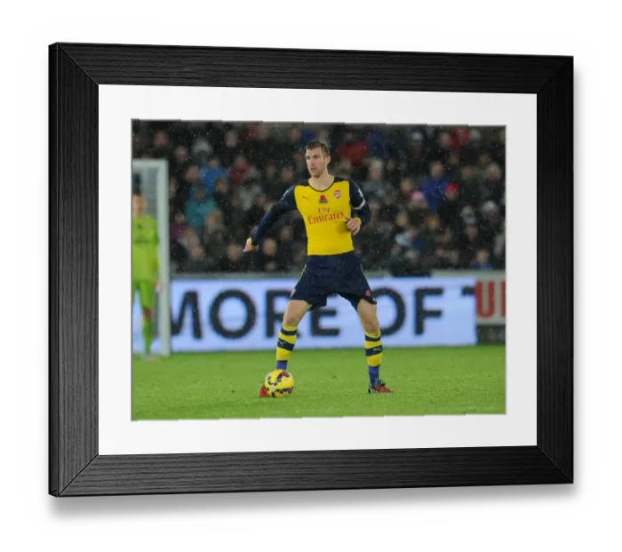 Framed Print : Per Mertesacker in Action: Swansea vs Arsenal, Premier League 2014-15