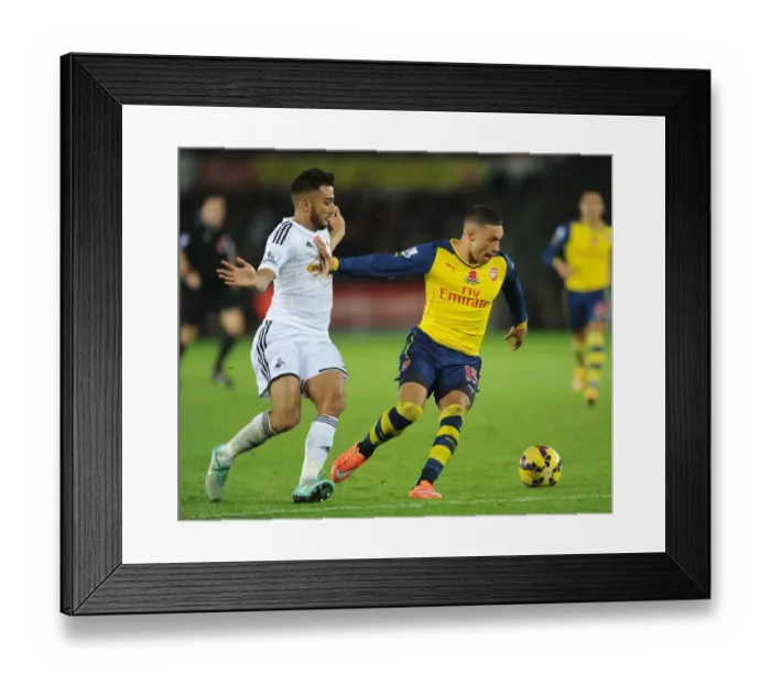Framed Print : Alex Oxlade-Chamberlain Stands Firm Against Neil Taylor's Challenge (Swansea vs Arsenal, 2014-15)