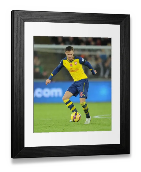 Framed Print : Aaron Ramsey in Action: Swansea vs Arsenal, Premier League 2014-15 Framed Print : Aaron Ramsey in Action: Swansea vs Arsenal, Premier League 2014-15