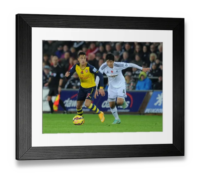 Framed Print : Clash of Stars: Sanchez vs. Ki Sunderland Showdown (Swansea v Arsenal, 2014-15) Framed Print : Clash of Stars: Sanchez vs. Ki Sunderland Showdown (Swansea v Arsenal, 2014-15)