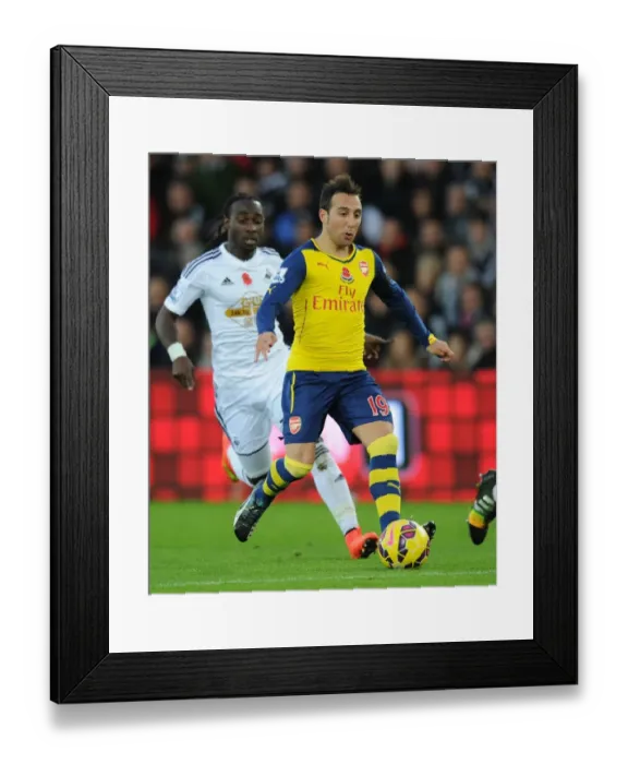 Framed Print : Santi Cazorla Dashes Past Marvin Emnes: Swansea vs. Arsenal, Premier League 2014-15 Framed Print : Santi Cazorla Dashes Past Marvin Emnes: Swansea vs. Arsenal, Premier League 2014-15