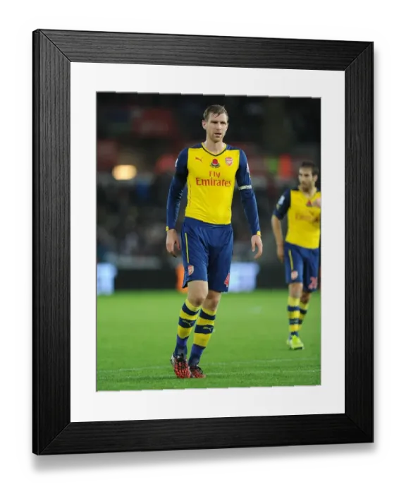 Framed Print : Per Mertesacker of Arsenal in Action against Swansea City (2014-15)