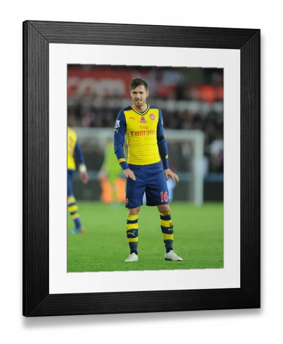 Framed Print : Aaron Ramsey in Action: Swansea vs Arsenal, Premier League 2014-15 Framed Print : Aaron Ramsey in Action: Swansea vs Arsenal, Premier League 2014-15