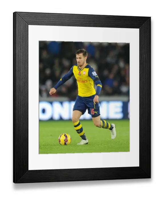 Framed Print : Aaron Ramsey in Action: Swansea vs Arsenal, Premier League 2014-15 Framed Print : Aaron Ramsey in Action: Swansea vs Arsenal, Premier League 2014-15
