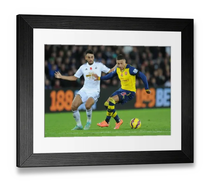 Framed Print : Clash at Liberty: Oxlade-Chamberlain vs Taylor - Swansea vs Arsenal, Premier League 2014-15 Framed Print : Clash at Liberty: Oxlade-Chamberlain vs Taylor - Swansea vs Arsenal, Premier League 2014-15