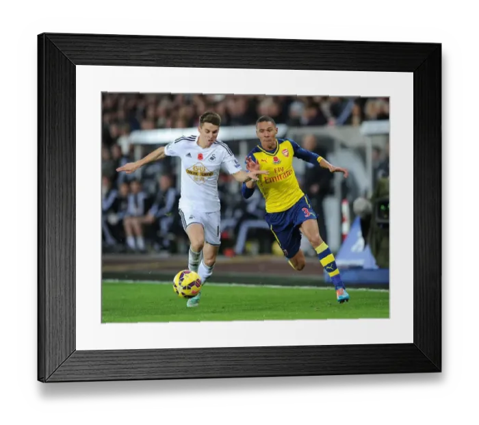 Framed Print : Clash at Liberty: Gibbs vs Carroll in Swansea v Arsenal Premier League Showdown