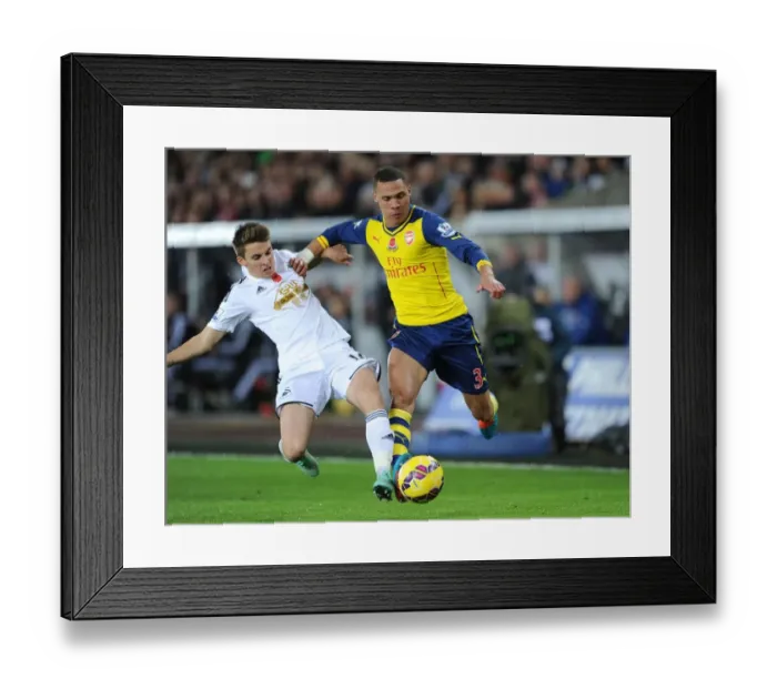 Framed Print : Gibbs vs Carroll: A Premier League Battle - Swansea v Arsenal (2014-15) Framed Print : Gibbs vs Carroll: A Premier League Battle - Swansea v Arsenal (2014-15)