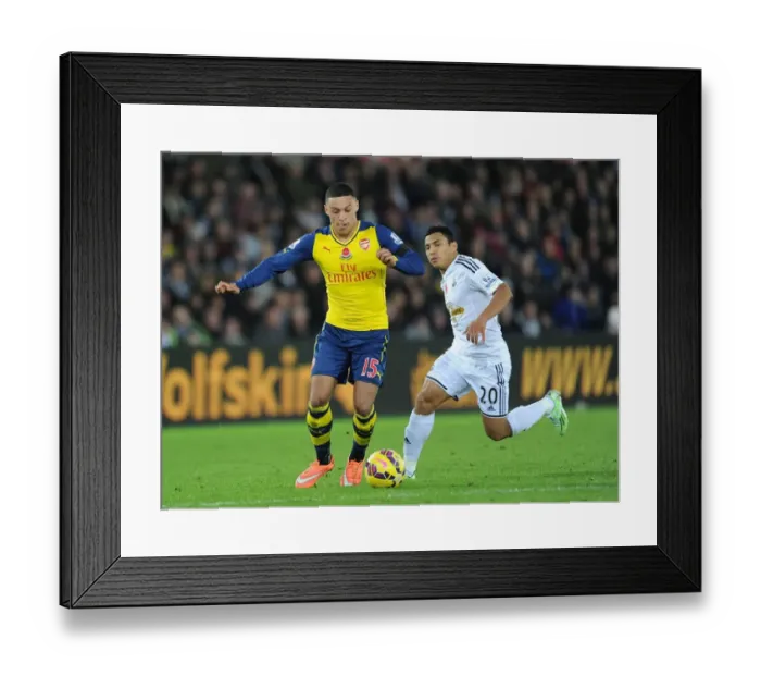 Framed Print : Oxlade-Chamberlain Outwits Montero: Arsenal's Star Outsmarts Swansea in Premier League Clash