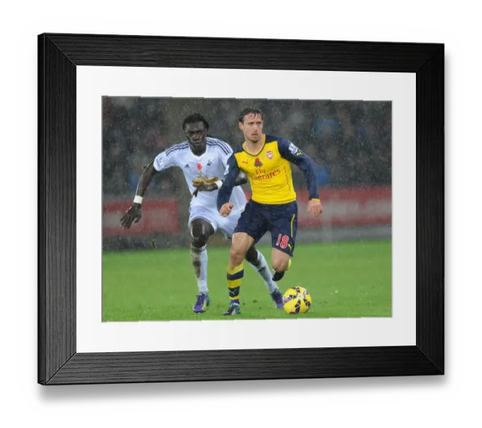 Framed Print : Nacho Monreal Outmaneuvers Bafetimbi Gomis: Swansea vs Arsenal, Premier League 2014-15 Framed Print : Nacho Monreal Outmaneuvers Bafetimbi Gomis: Swansea vs Arsenal, Premier League 2014-15