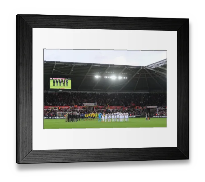 Framed Print : Swansea vs Arsenal: Premier League Showdown - Moment of Silence (November 2014) Framed Print : Swansea vs Arsenal: Premier League Showdown - Moment of Silence (November 2014)