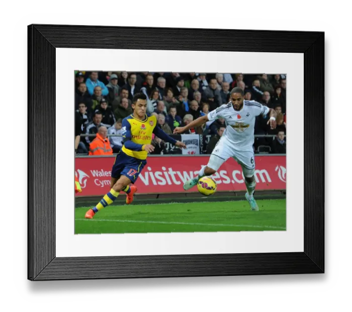 Framed Print : Clash of Titans: Sanchez vs. Williams - Arsenal's Star Forward Goes Head-to-Head with Swansea's Defiant Captain Framed Print : Clash of Titans: Sanchez vs. Williams - Arsenal's Star Forward Goes Head-to-Head with Swansea's Defiant Captain