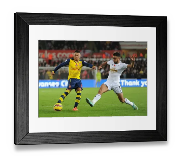 Framed Print : Clash at Liberty: Oxlade-Chamberlain vs Taylor - Arsenal vs Swansea, Premier League 2014: A Battle Between Two Stars