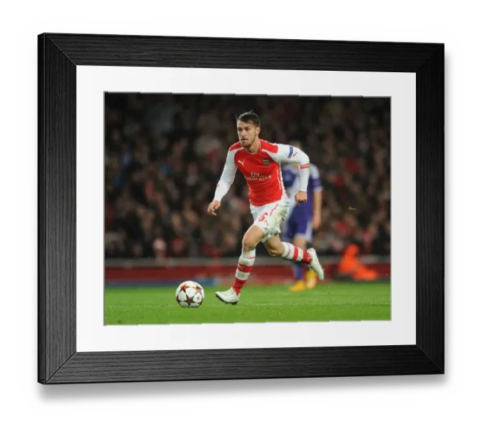 Framed Print : Aaron Ramsey: Arsenal Star in Action against RSC Anderlecht, UEFA Champions League, 2014 Framed Print : Aaron Ramsey: Arsenal Star in Action against RSC Anderlecht, UEFA Champions League, 2014