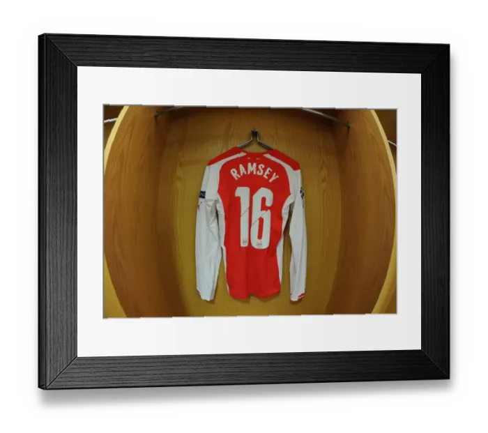 Framed Print : Aaron Ramsey's Arsenal Kit in Arsenal FC Changing Room before Arsenal v RSC Anderlecht, UEFA Champions League (2014)